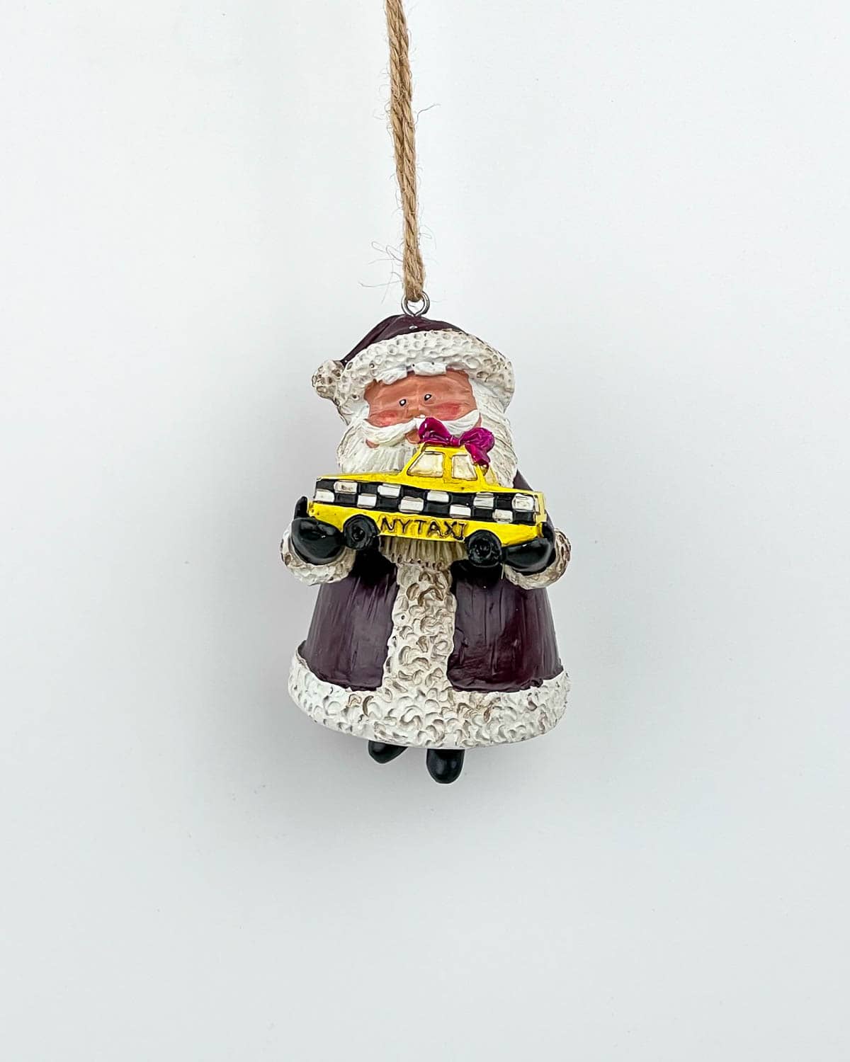 Santa Holding a Yellow Cap NYC Taxi Christmas Ornament